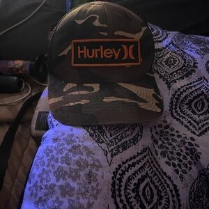 Hurley Camouflage Hat with Bold Orange Emblem